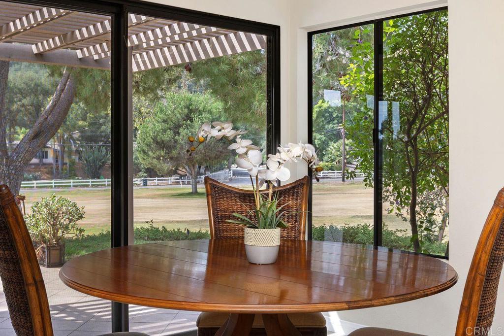 4119 Oak Island Lane Fallbrook, CA 92028 - Photo 12 of 54 a dining room with a table and chairs