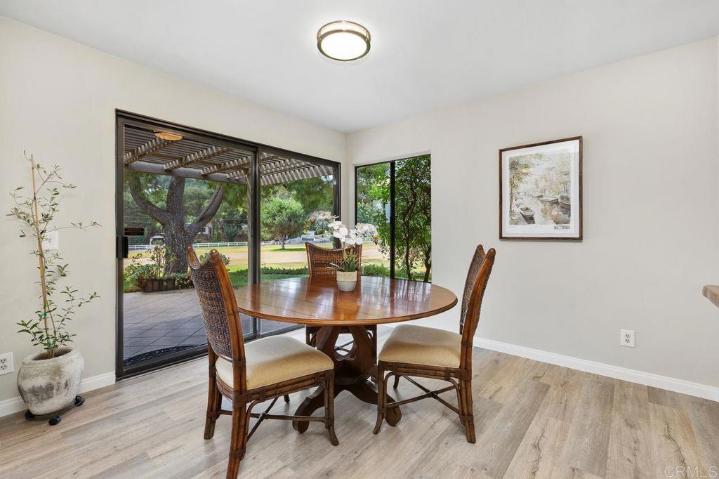 4119 Oak Island Lane Fallbrook, CA 92028 - Photo 13 of 54 a view of a dining room with furniture window and wooden floor