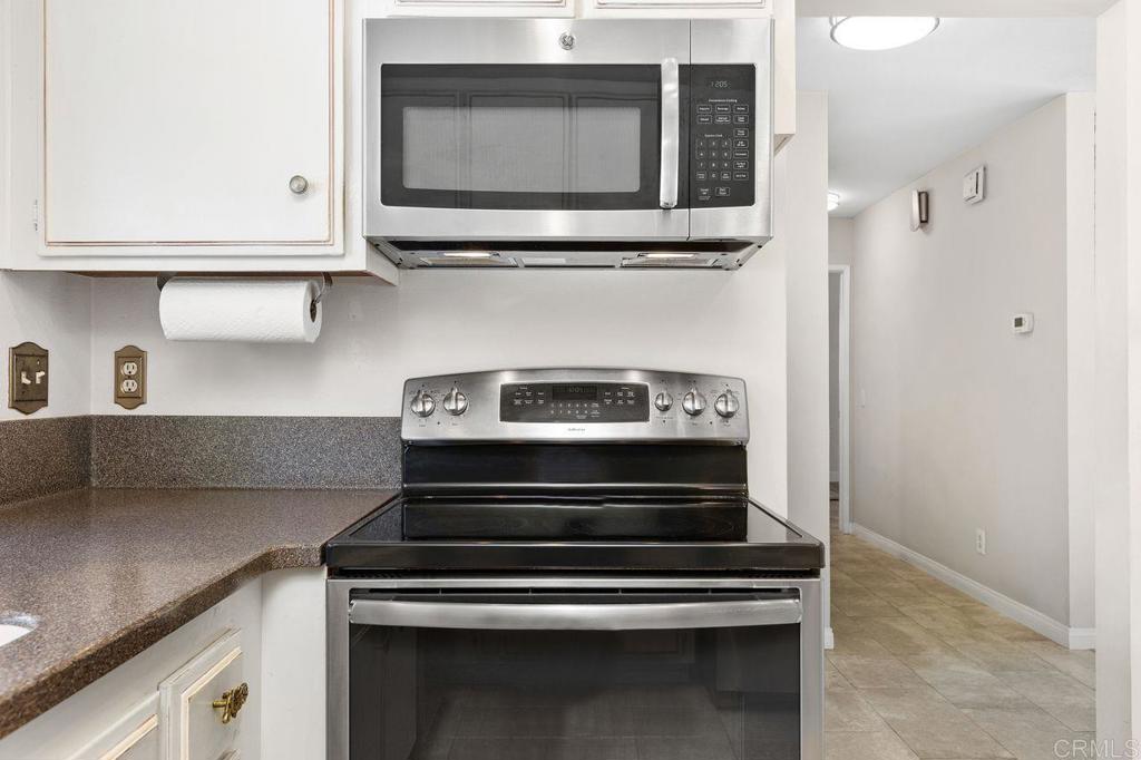 4119 Oak Island Lane Fallbrook, CA 92028 - Photo 20 of 54 a stove top oven sitting inside of a kitchen