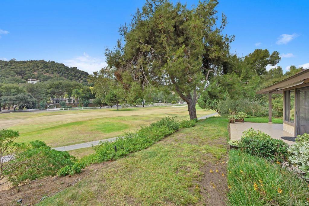 4119 Oak Island Lane Fallbrook, CA 92028 - Photo 40 of 54 a view of green field with tree in the background