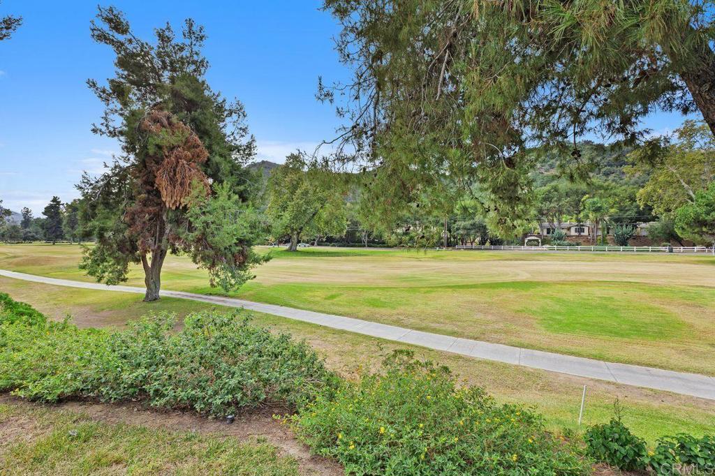 4119 Oak Island Lane Fallbrook, CA 92028 - Photo 48 of 54 a view of a yard with a large trees
