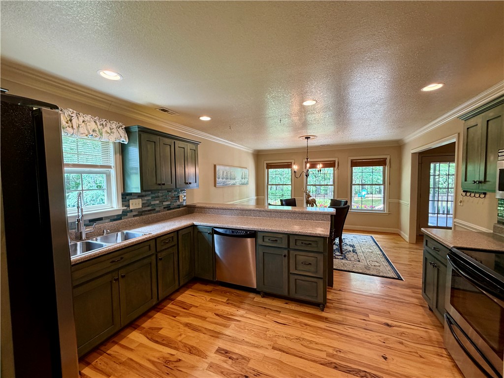 232 Hunters Trail Walhalla, SC 29691 - Photo 15 of 38 This spacious kitchen offers a seamless flow into the dining area, perfect for entertaining.