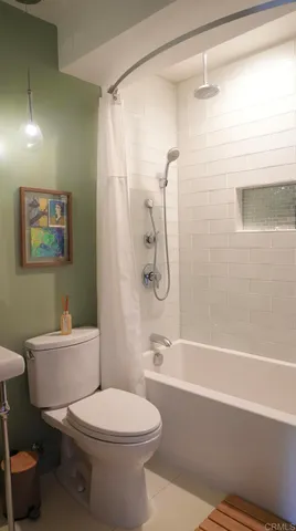 a bathroom with a toilet a sink and a bathtub