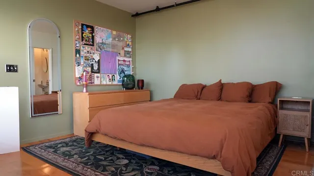 a bedroom with bed and window