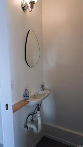 a bathroom with a sink and mirror