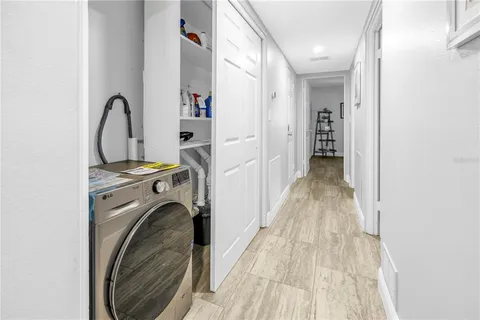 a view of a hallway with shelves