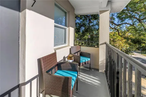 a view of a balcony with wooden floor