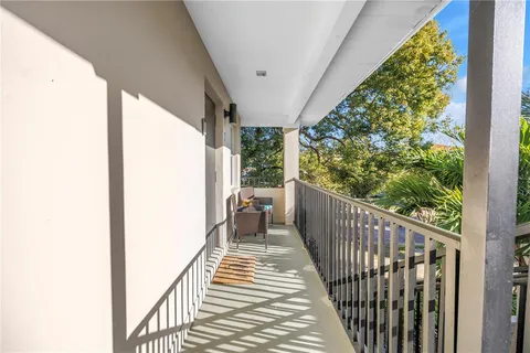 a view of balcony with furniture