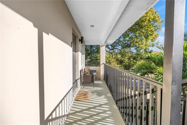a view of balcony with furniture