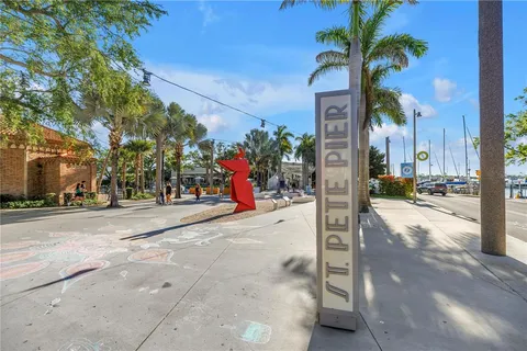 a front view of a house with a tree s
