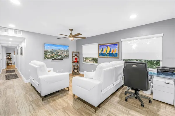 a kitchen with granite countertop a sink cabinets and stainless steel appliances