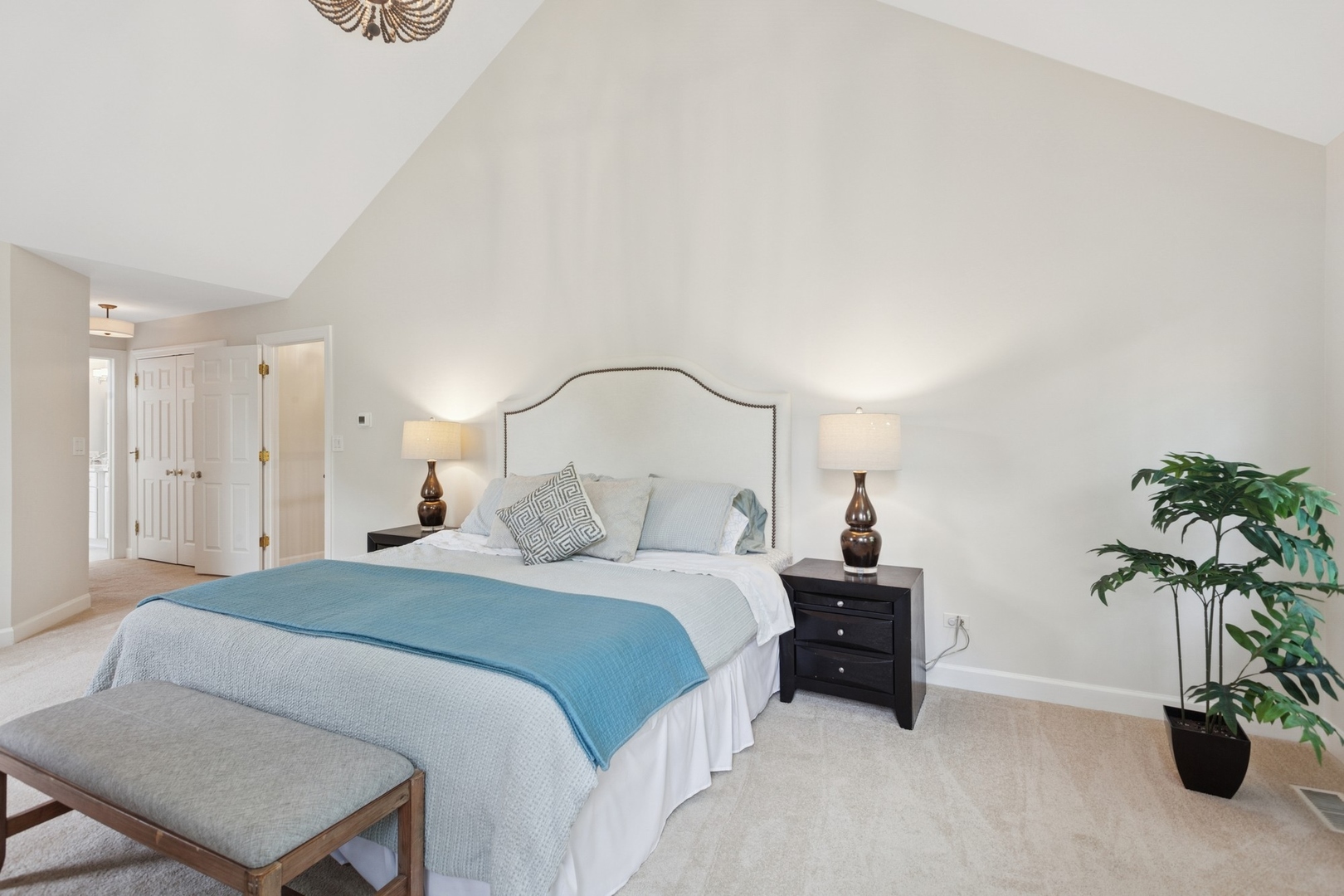 415 Fuller Road Hinsdale, IL 60521 - Photo 18 of 39 a bedroom with a bed and a potted plant