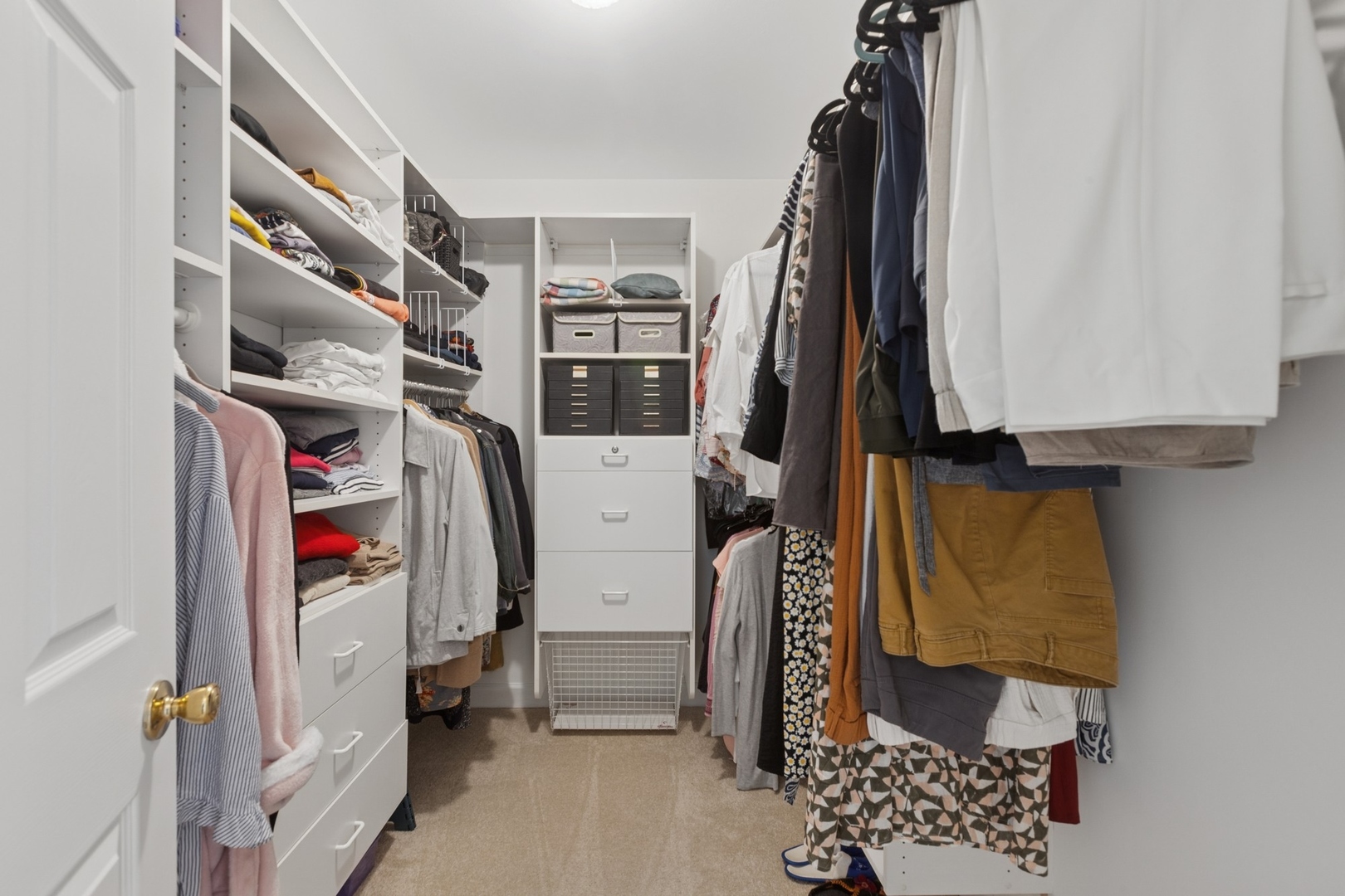 415 Fuller Road Hinsdale, IL 60521 - Photo 20 of 39 a view of walk in closet with clothes and shoes