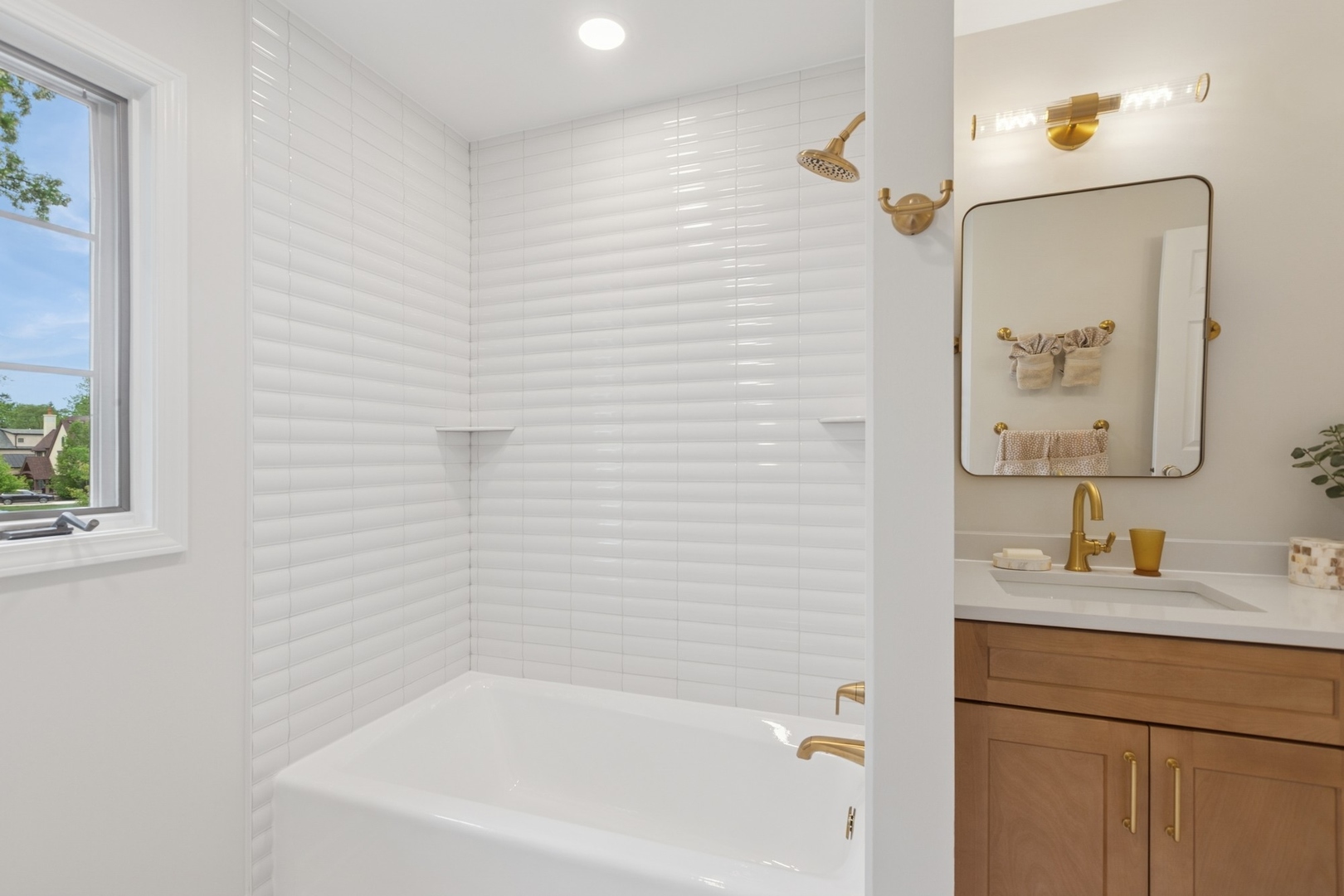 415 Fuller Road Hinsdale, IL 60521 - Photo 27 of 39 a bathroom with a tub shower vanity and a sink
