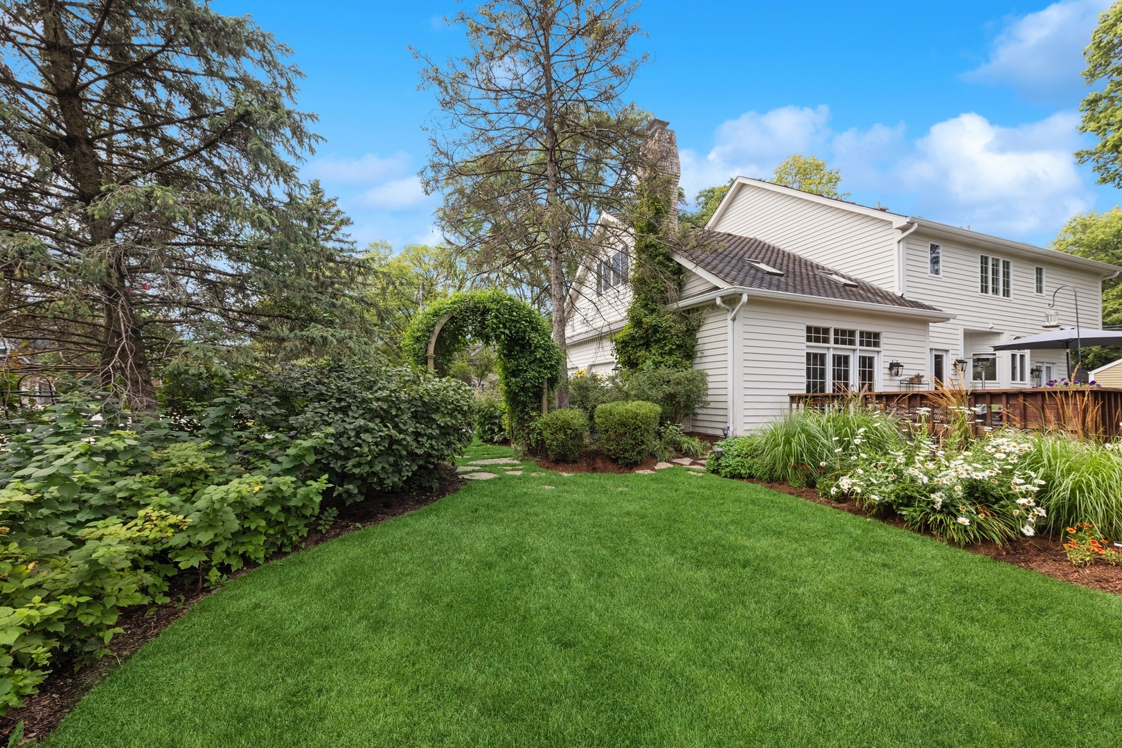 415 Fuller Road Hinsdale, IL 60521 - Photo 31 of 39 a view of a house with backyard and garden