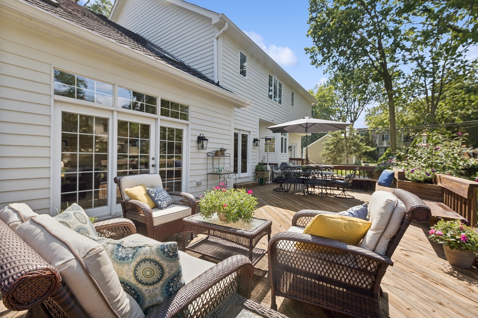 415 Fuller Road Hinsdale, IL 60521 - Photo 33 of 39 a view of a patio with couches table and chairs and potted plants