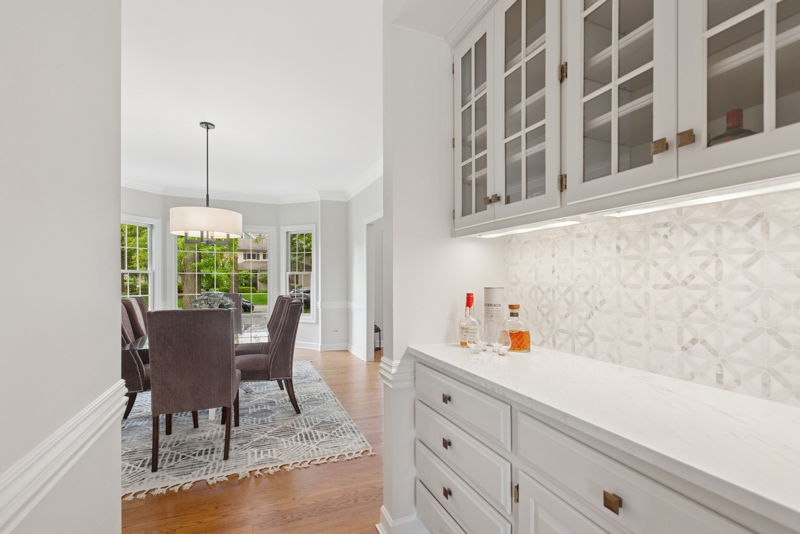 415 Fuller Road Hinsdale, IL 60521 - Photo 7 of 39 a view of a dining room with furniture window and outside view