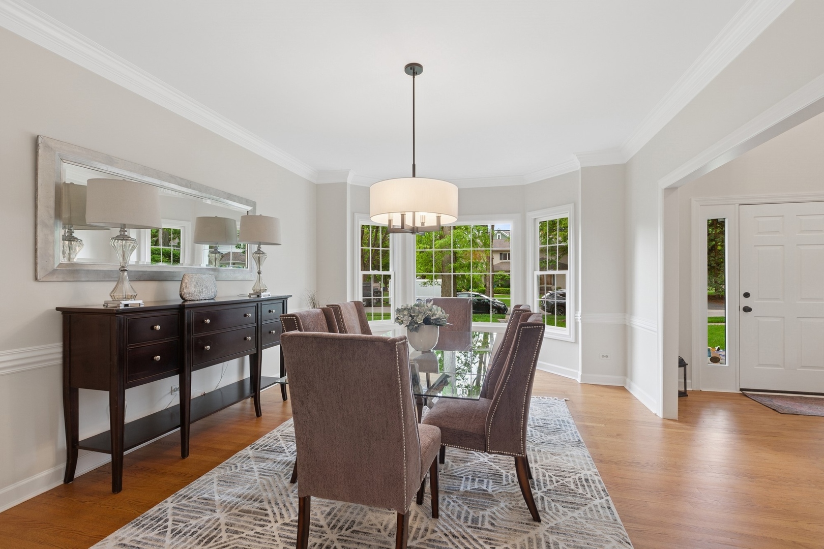 415 Fuller Road Hinsdale, IL 60521 - Photo 9 of 39 a dining room with furniture window wooden floor