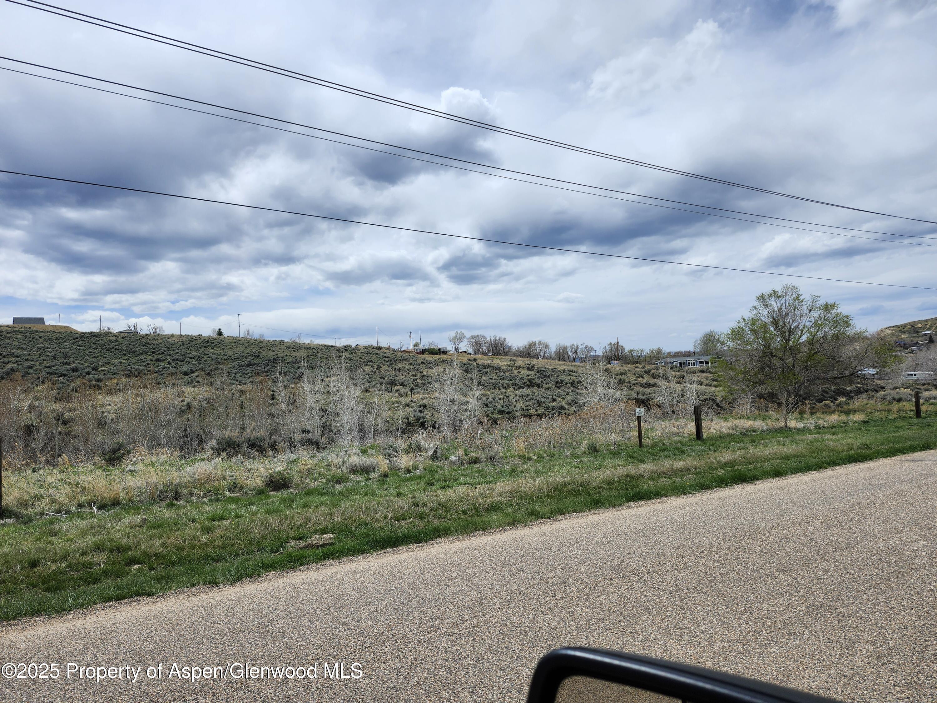 Tbd Pine Street, Unit 3739 Craig, CO 81625 - Photo 4 of 6 a view of a city street with a yard