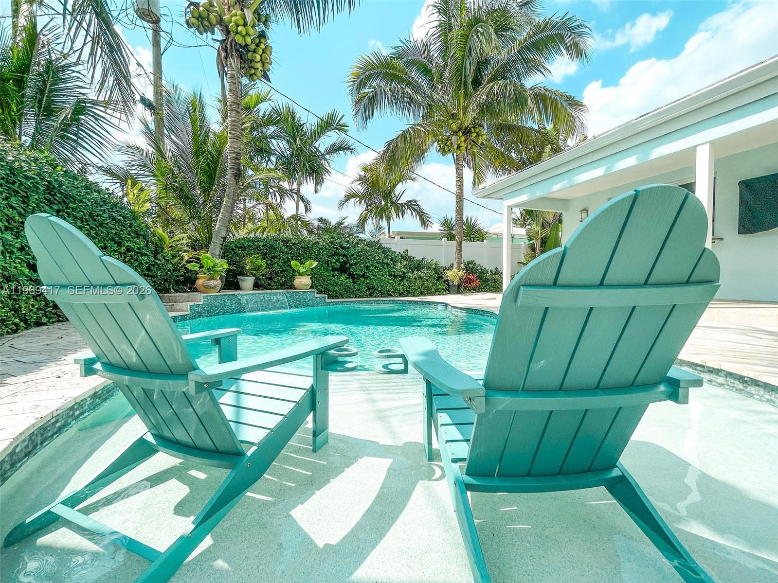 a view of a two chairs in a yard