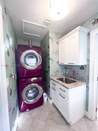 a view of washer and dryer in a utility room