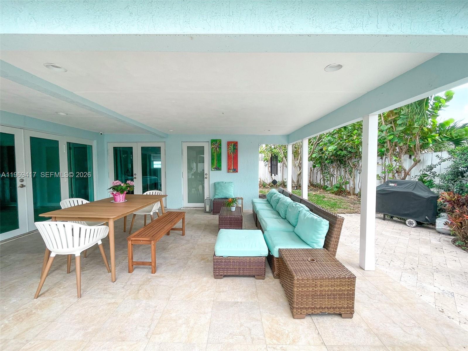 2932 Northeast 36th Street Lighthouse Point, FL 33064 - Photo 21 of 34 a living room with furniture and a large window