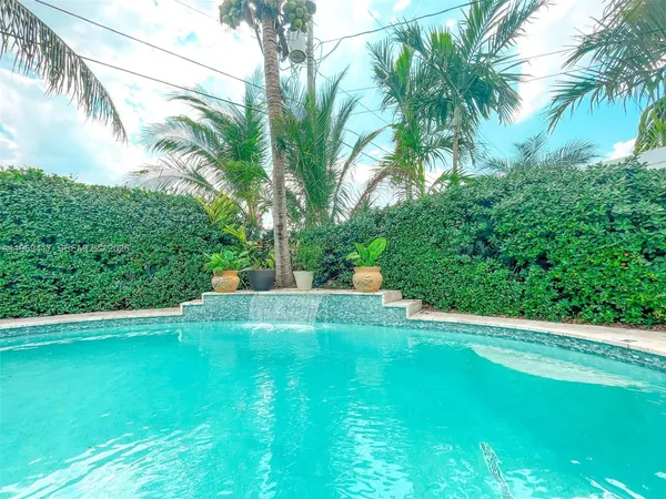 a view of a backyard with a small pool