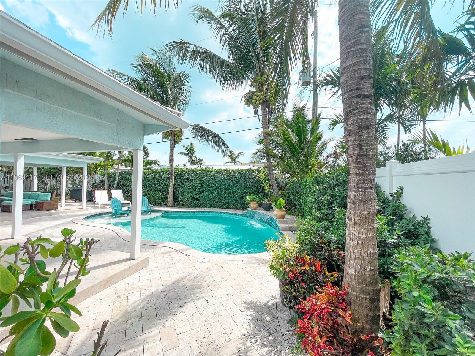 2932 Northeast 36th Street Lighthouse Point, FL 33064 - Photo 26 of 34 a house with a garden space