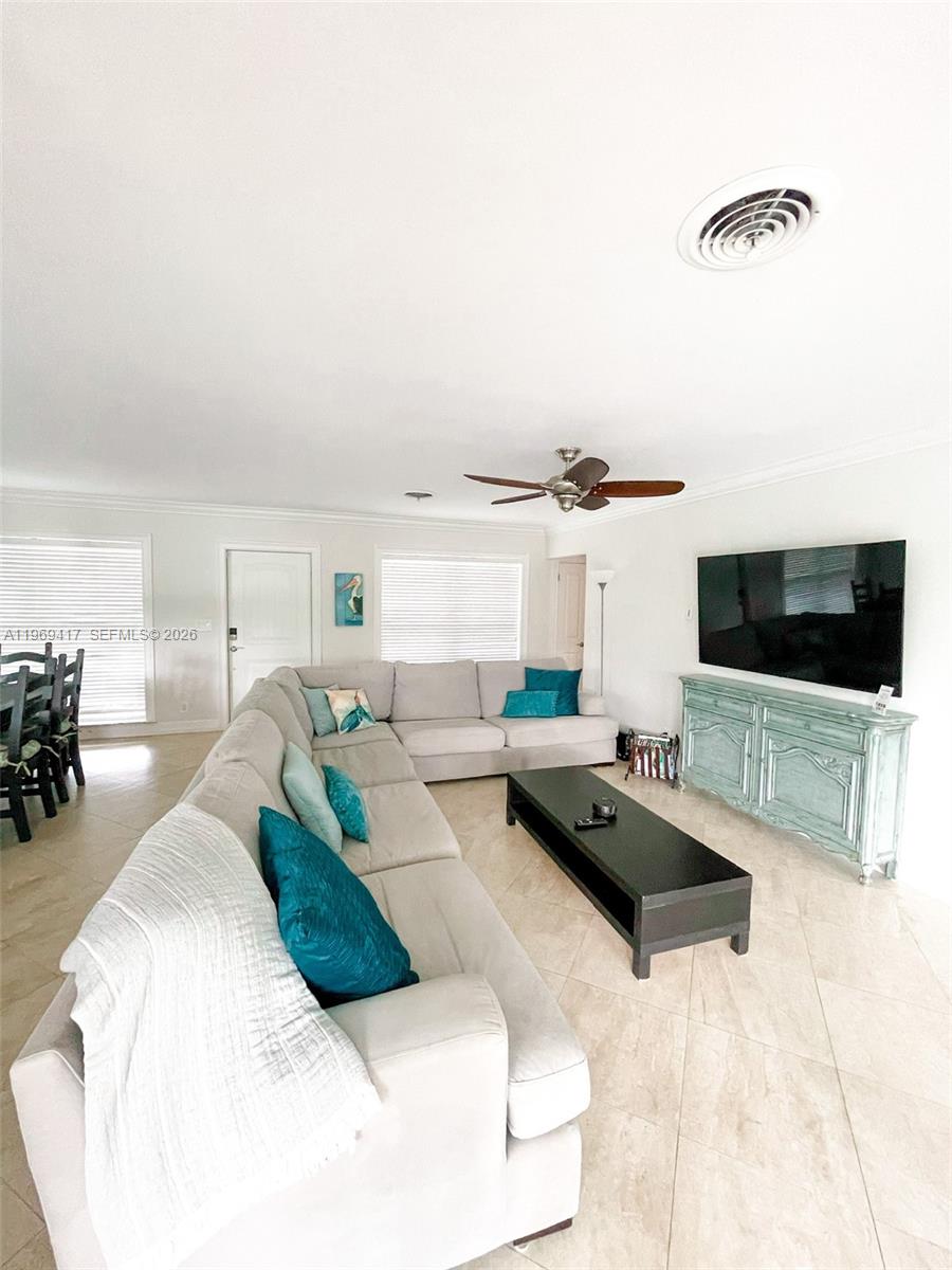 2932 Northeast 36th Street Lighthouse Point, FL 33064 - Photo 3 of 34 a living room with furniture and a flat screen tv