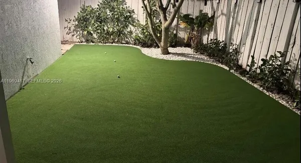 a view of a livingroom with furniture and a window