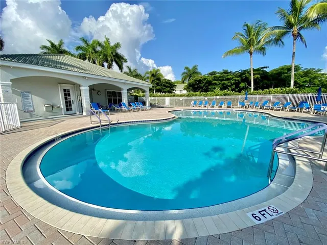 a view of a swimming pool with a sitting space