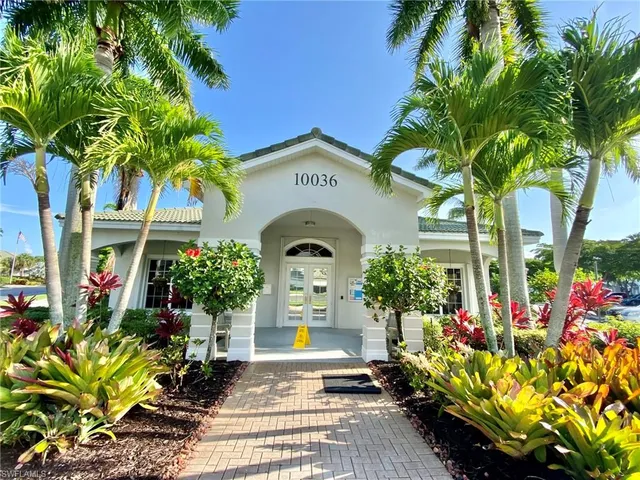 a view of a yard and swimming pool
