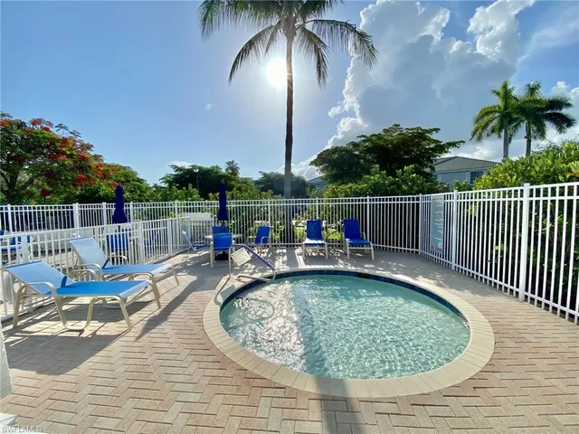 a view of a swimming pool with a patio