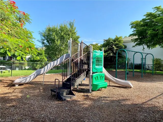 a view of a park with a slide