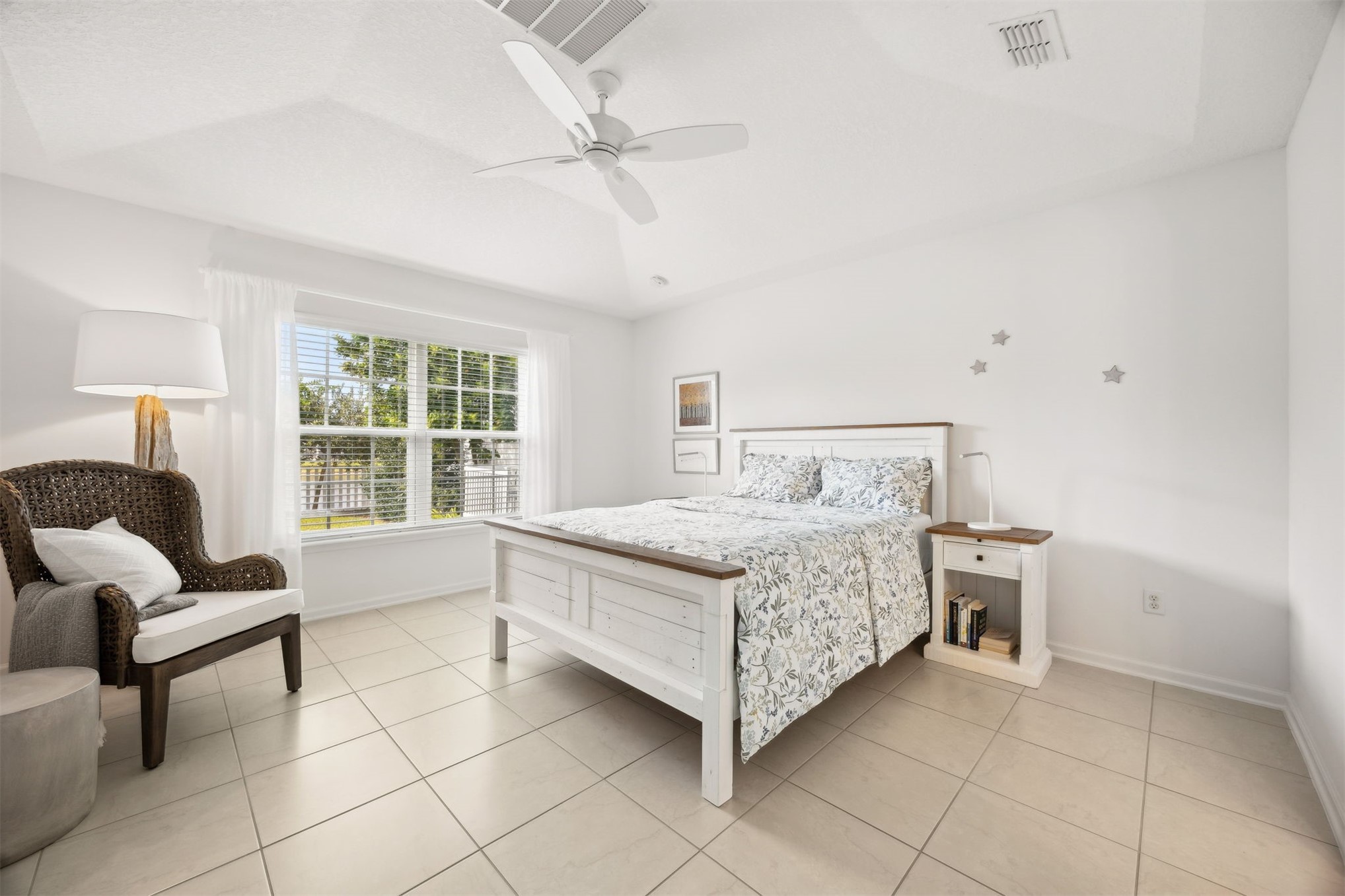 94037 Last Lane Yulee, FL 32097 - Photo 17 of 38 a bedroom with a bed a table and chair