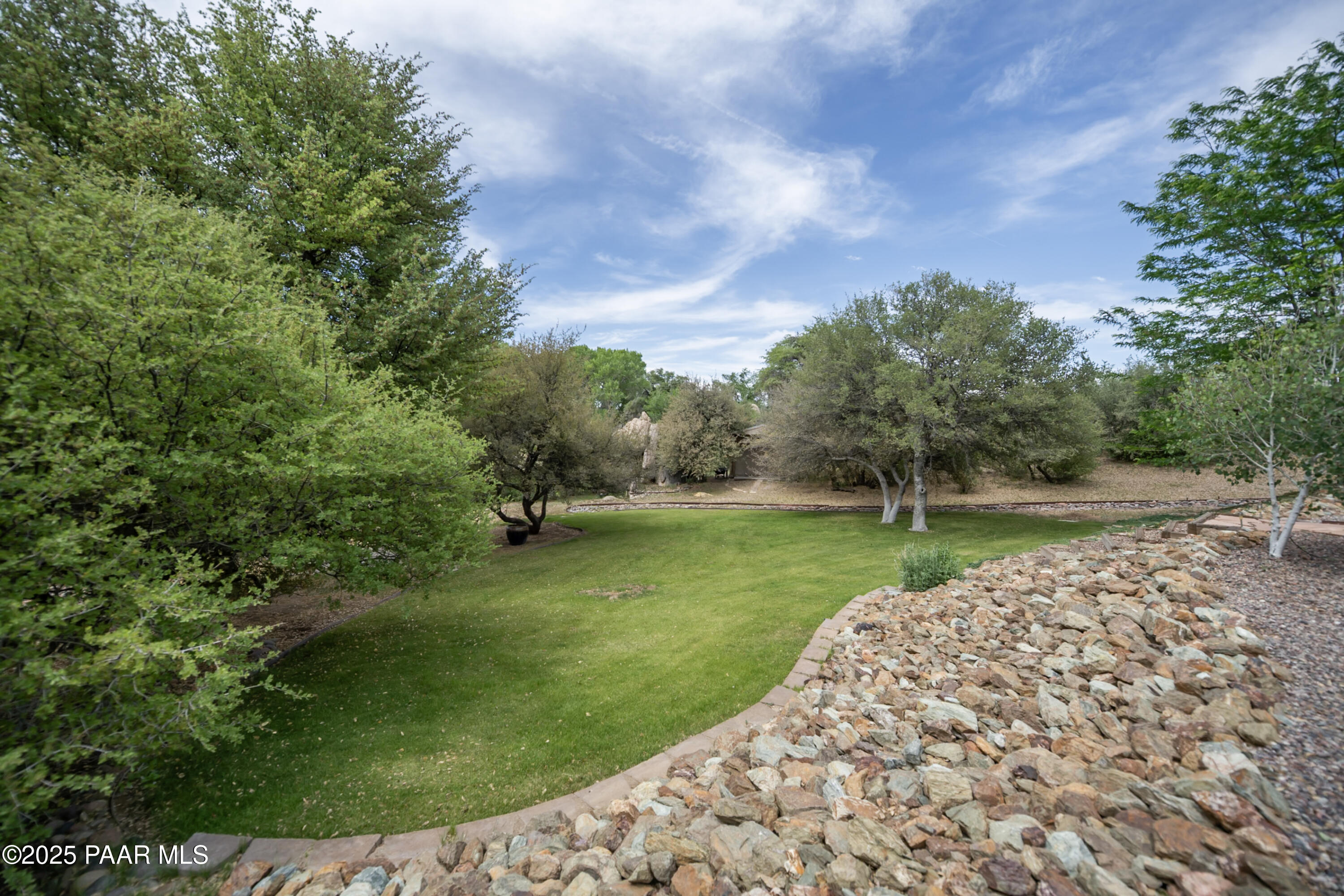 770 Grisby Road Skull Valley, AZ 86338 - Photo 43 of 58 a view of a garden with a fountain