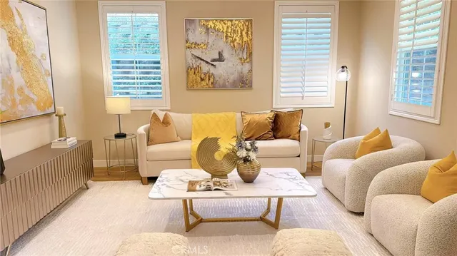 a living room with furniture and a large window