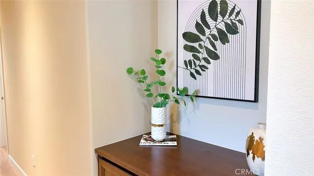 a vase with flowers sitting on a table