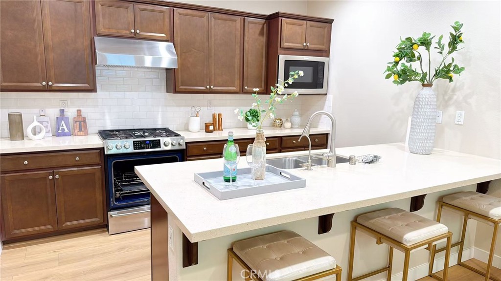 2029 Tracy Lane Alhambra, CA 91803 - Photo 5 of 25 a kitchen with a sink a stove and cabinets