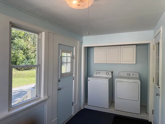 a view of livingroom with furniture and closet