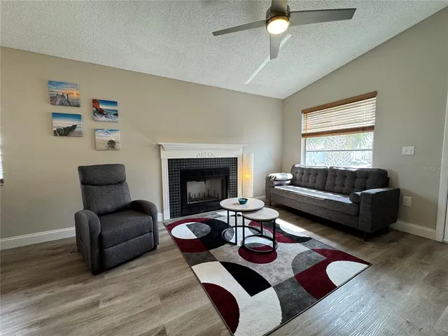 a view of a dining room with furniture and a window