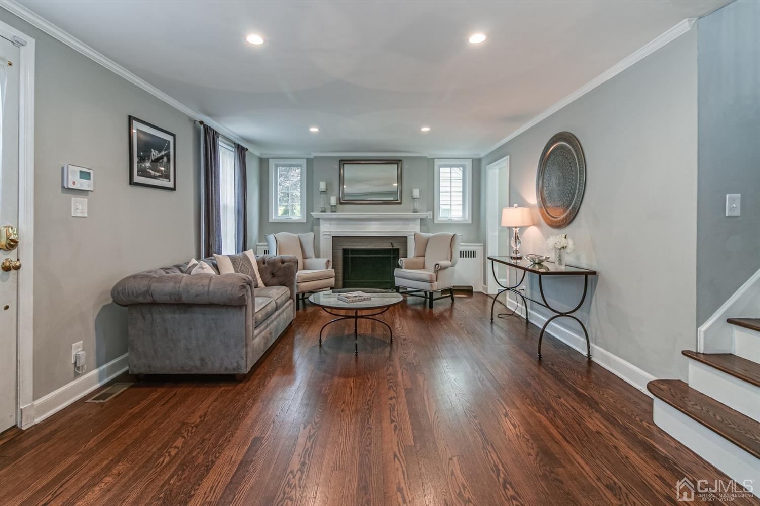 15 Edgewood Road Edison, NJ 08820 - Photo 3 of 35 a living room with furniture and a fireplace
