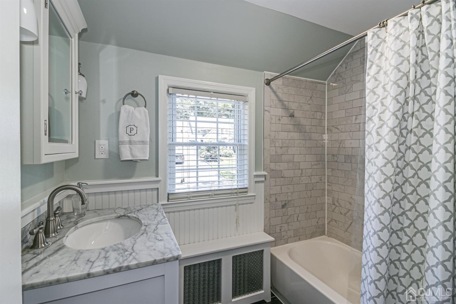 15 Edgewood Road Edison, NJ 08820 - Photo 22 of 35 a bathroom with a granite countertop sink a toilet and shower