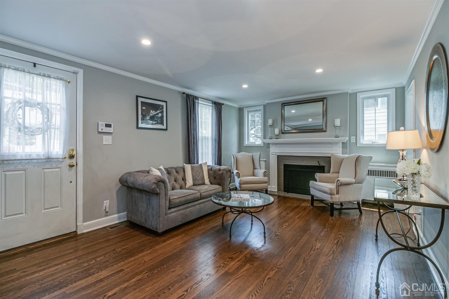15 Edgewood Road Edison, NJ 08820 - Photo 4 of 35 a living room with furniture and a fireplace