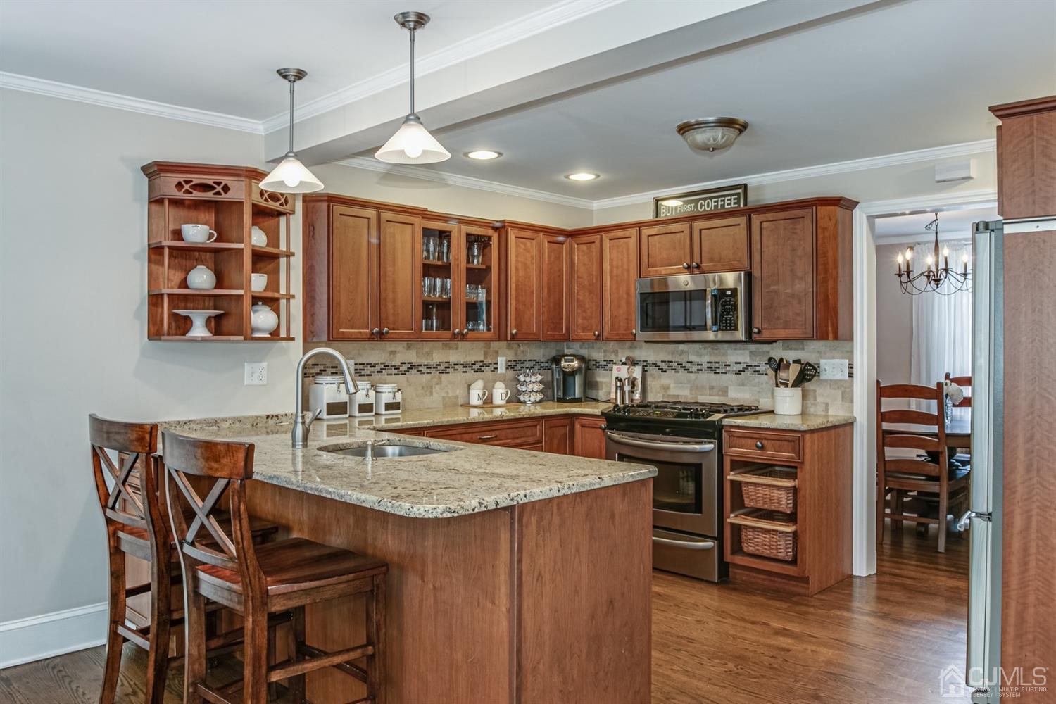 15 Edgewood Road Edison, NJ 08820 - Photo 8 of 35 a kitchen with stainless steel appliances granite countertop a stove top oven a sink and a refrigerator