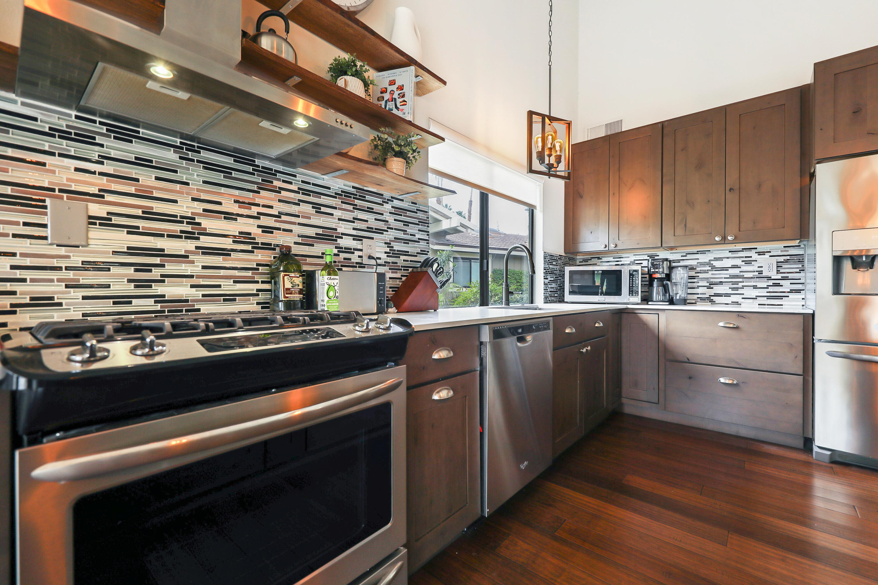 331 Red River Road Palm Desert, CA 92211 - Photo 12 of 56 a kitchen with a stove and a microwave