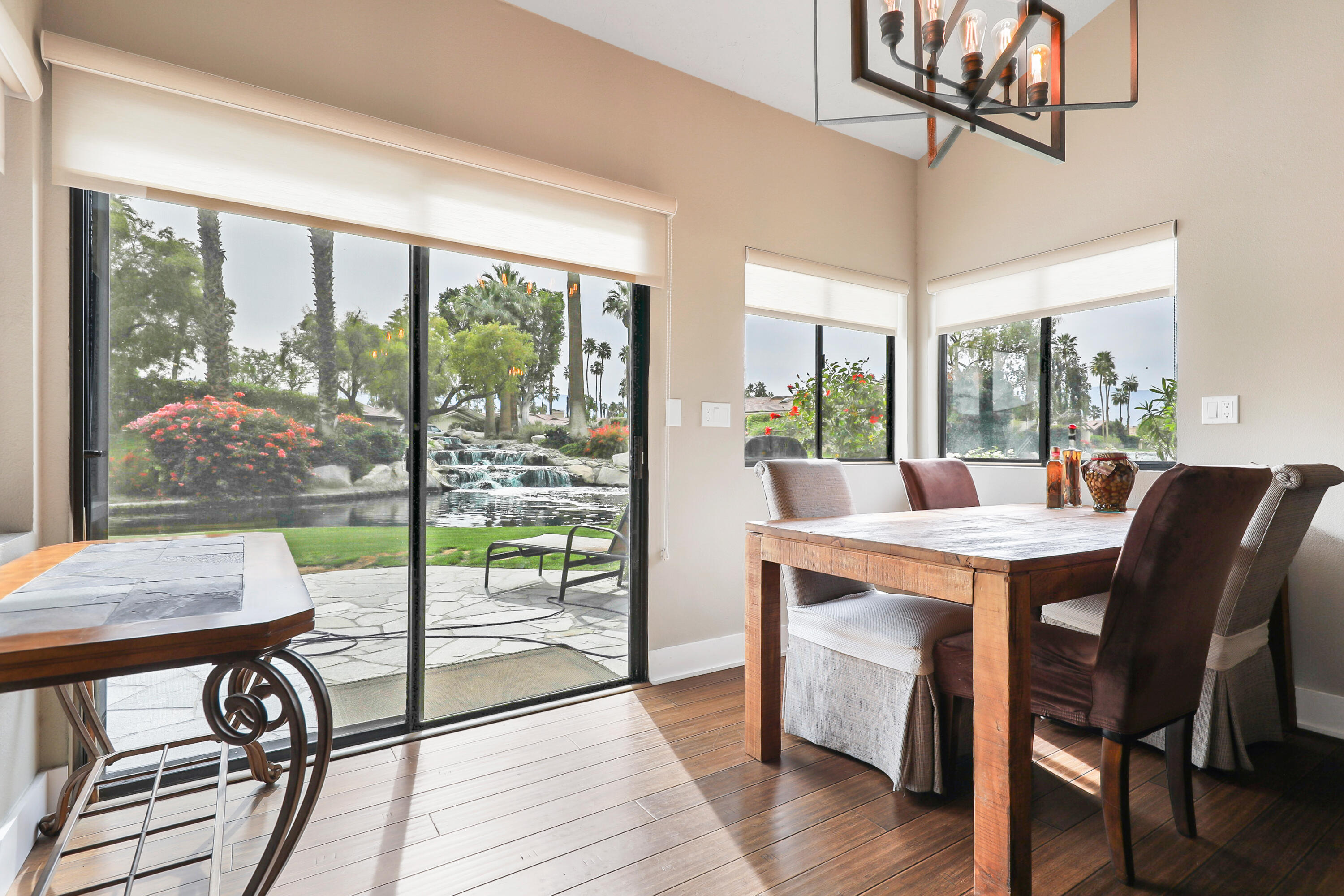 331 Red River Road Palm Desert, CA 92211 - Photo 14 of 56 a view of a dining room with furniture window and wooden floor