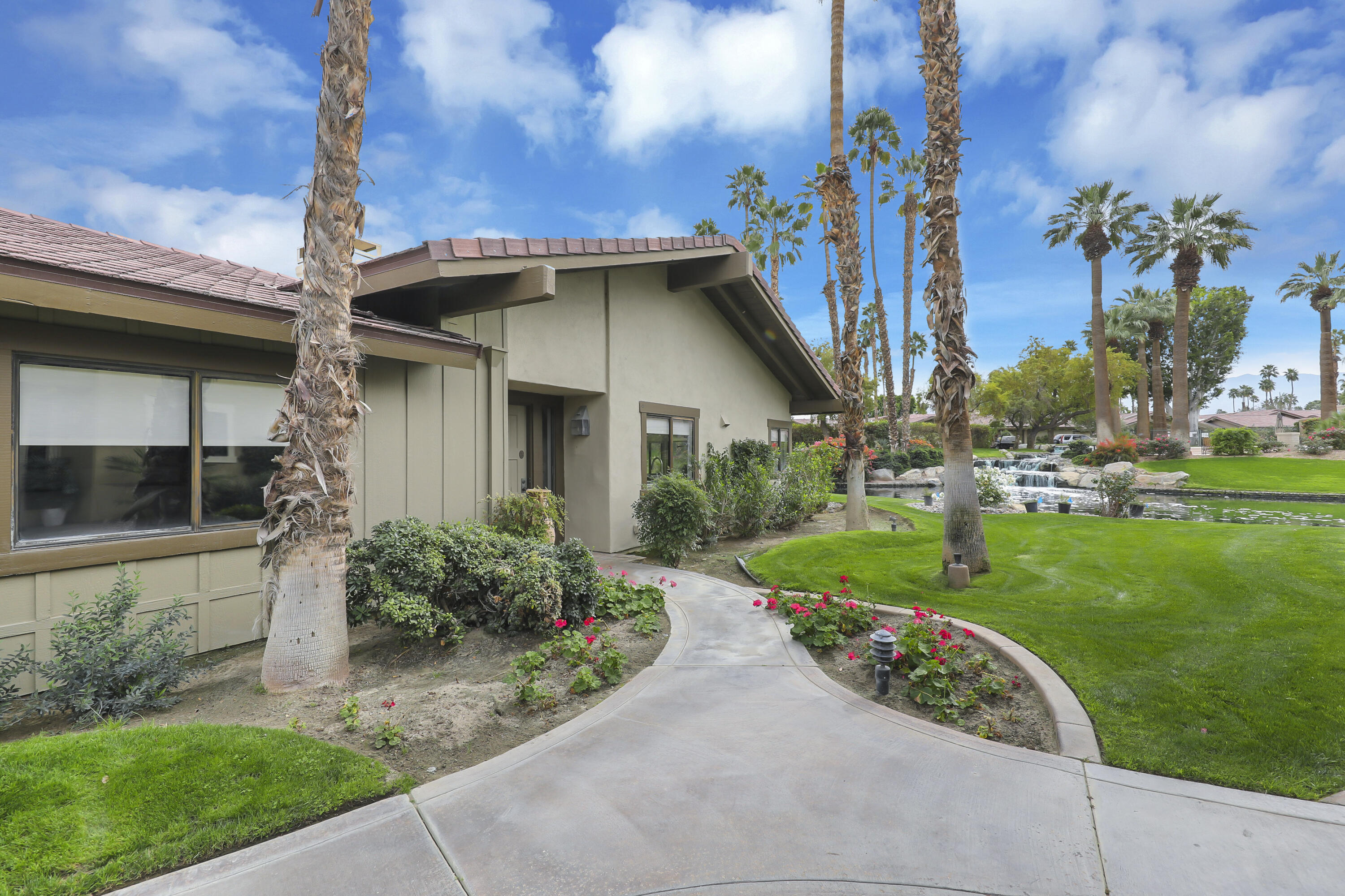331 Red River Road Palm Desert, CA 92211 - Photo 56 of 56 a front view of a house with garden