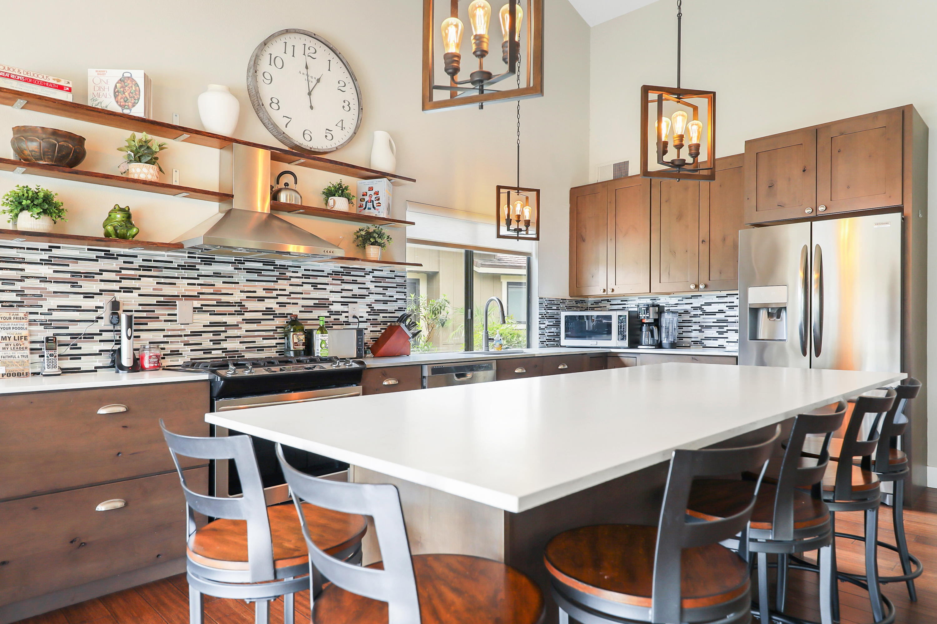 331 Red River Road Palm Desert, CA 92211 - Photo 9 of 56 a kitchen with a table chairs and a refrigerator