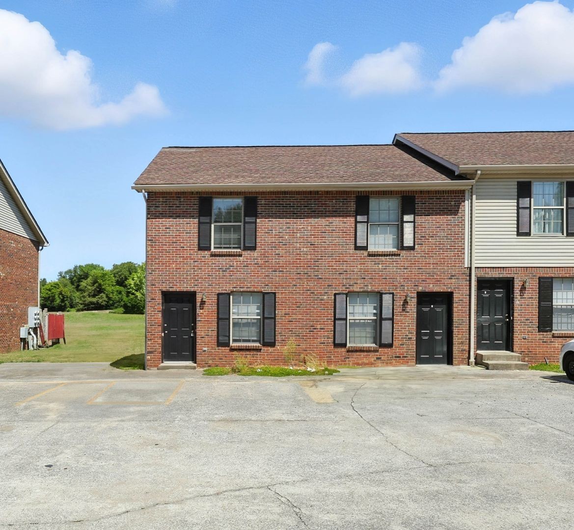 285 State Line Road Oak Grove, KY 42262 - Photo 16 of 18 a front view of a house with a yard